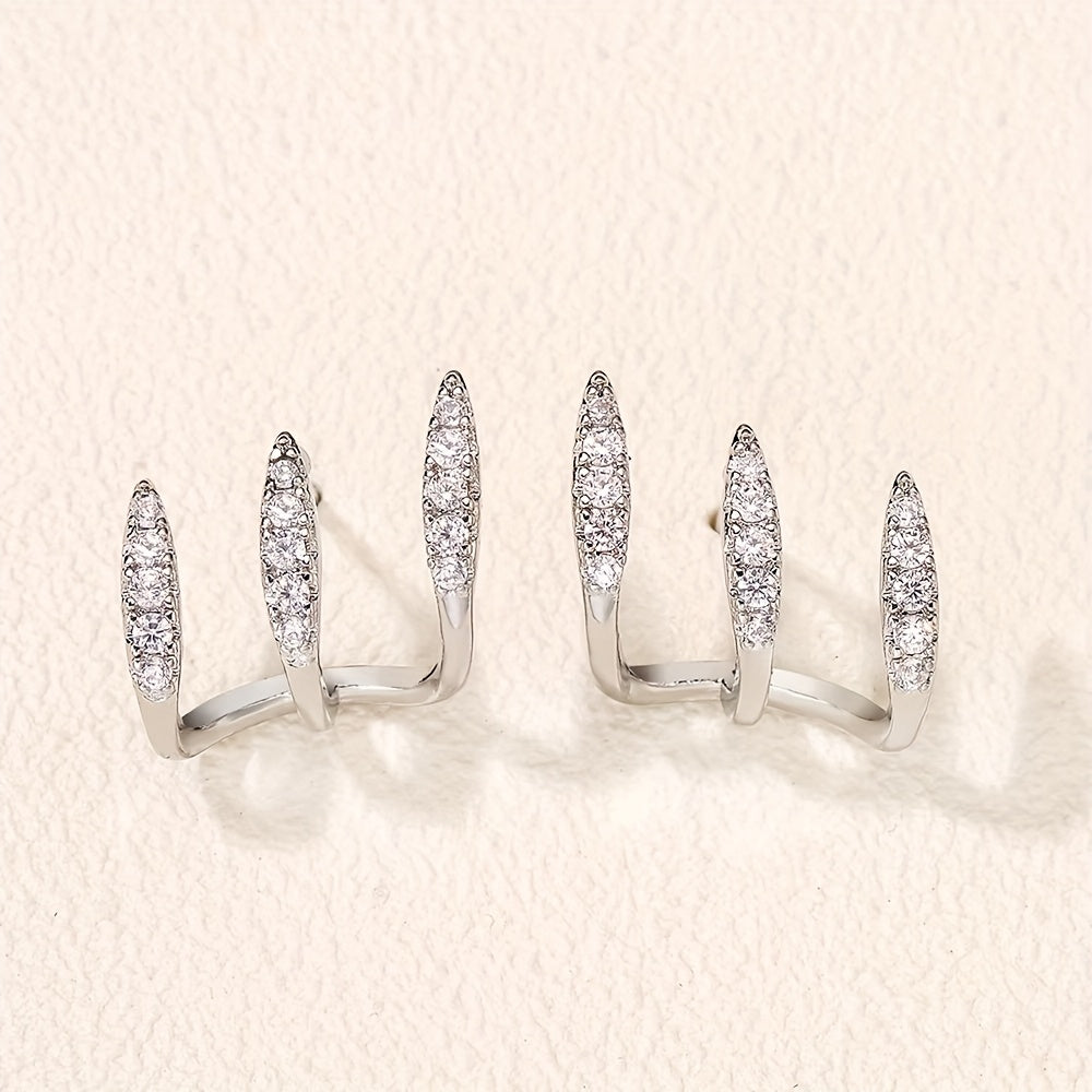 Elegante Ohrringe mit drei Klauen aus Strass