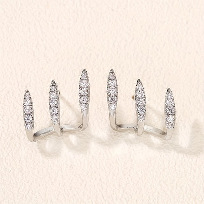 Elegante Ohrringe mit drei Klauen aus Strass