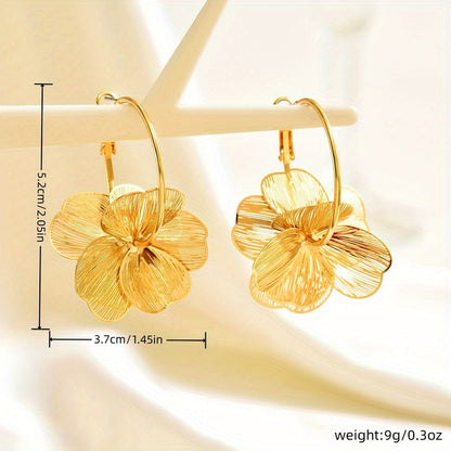 Übertriebene goldene hohle Ohrringe