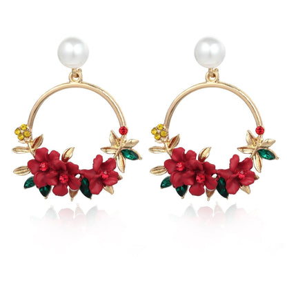 Elegante Goldblumen- und Perlenohrringe