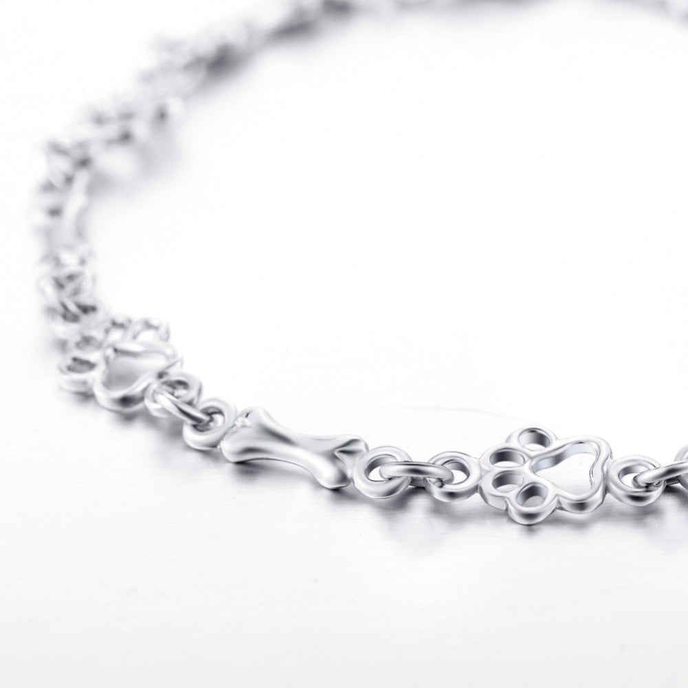 Limitierte Edition: Armband mit reinem Silber und Hundepfoten- und Knochen-Anhängern