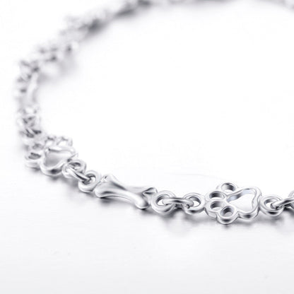 Limitierte Edition: Armband mit reinem Silber und Hundepfoten- und Knochen-Anhängern